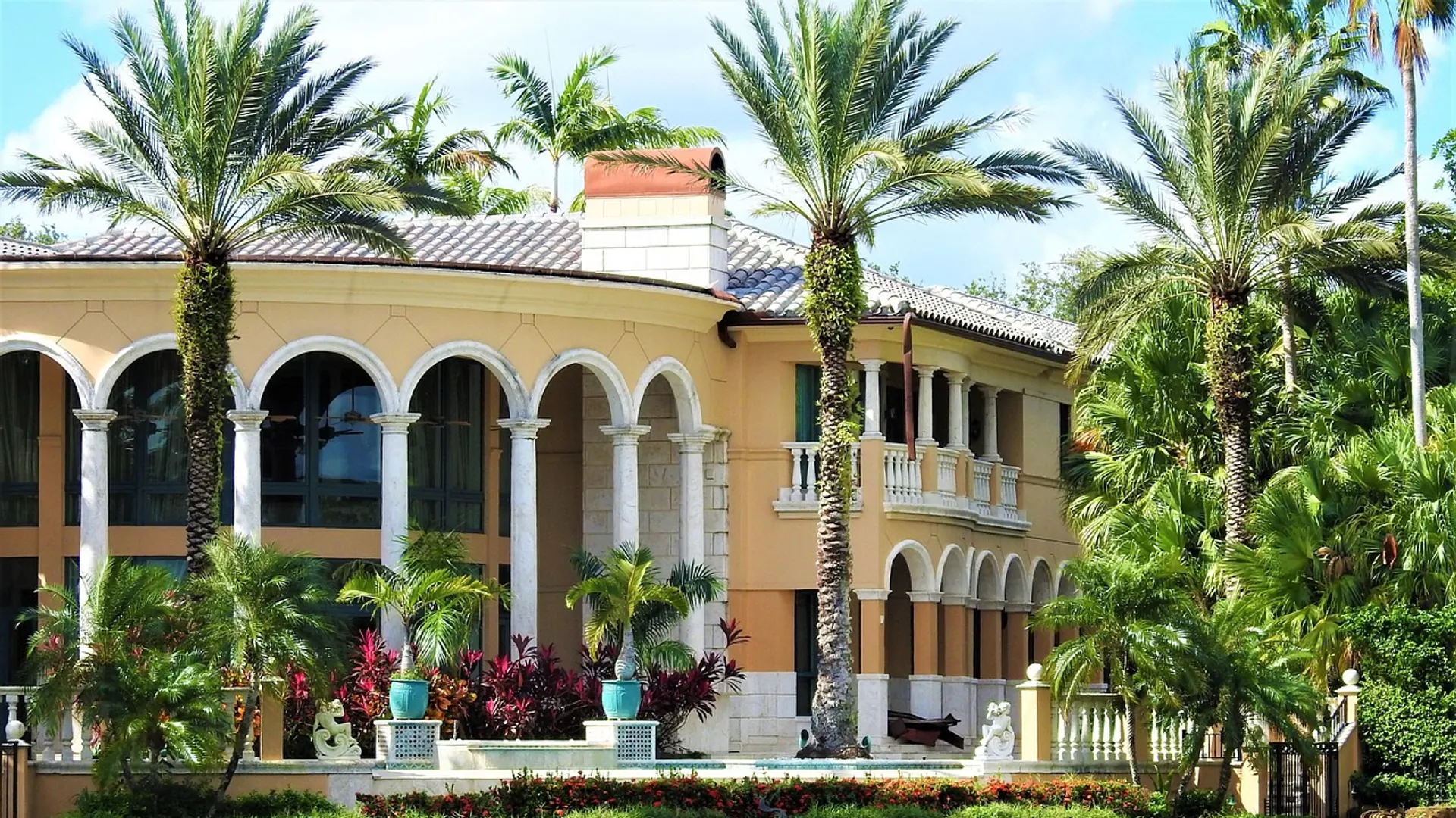 Florida luxury Mediterranean estate framed by palms